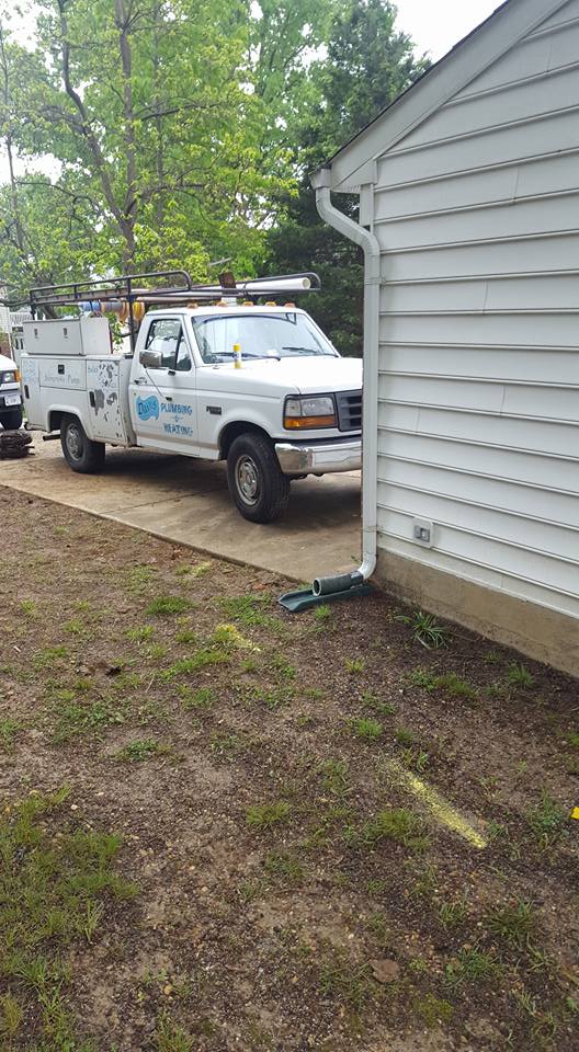 Davis Plumbing & Heating service truck at a customer's home